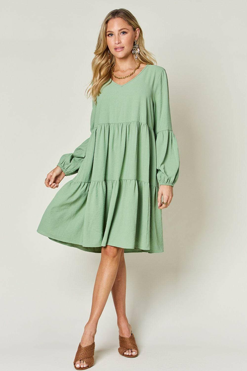 Double Vision V-Neck Balloon Sleeve Tiered DressDouble Vision V-Neck Balloon Sleeve Tiered Dress
 Step into the spotlight with our Double Vision V-Neck Balloon Sleeve Tiered Dress, a masterpiece designed to turn hLove Salve -Neck Balloon Sleeve Tiered DressColor