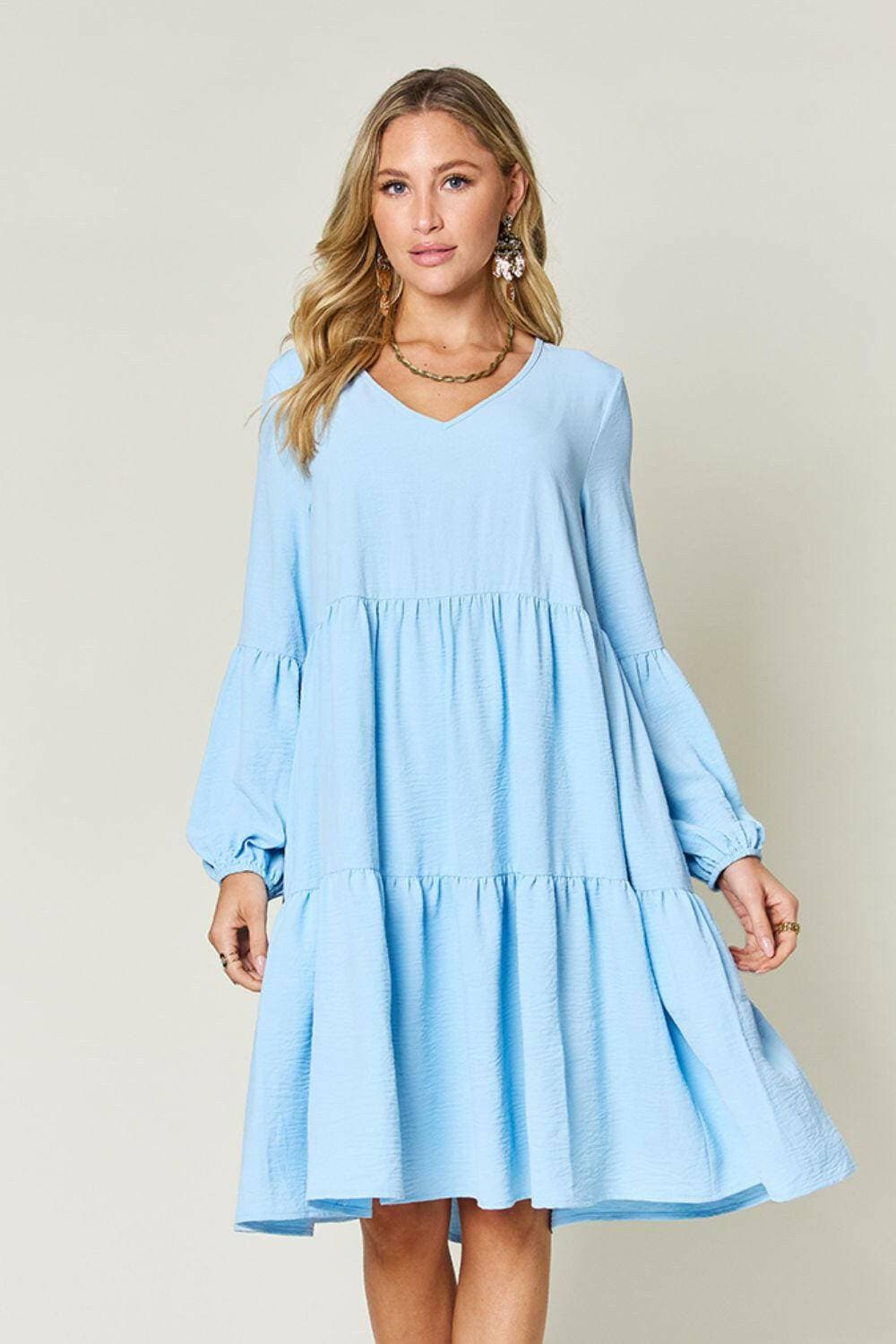 Double Vision V-Neck Balloon Sleeve Tiered DressDouble Vision V-Neck Balloon Sleeve Tiered Dress
 Step into the spotlight with our Double Vision V-Neck Balloon Sleeve Tiered Dress, a masterpiece designed to turn hLove Salve -Neck Balloon Sleeve Tiered DressColor