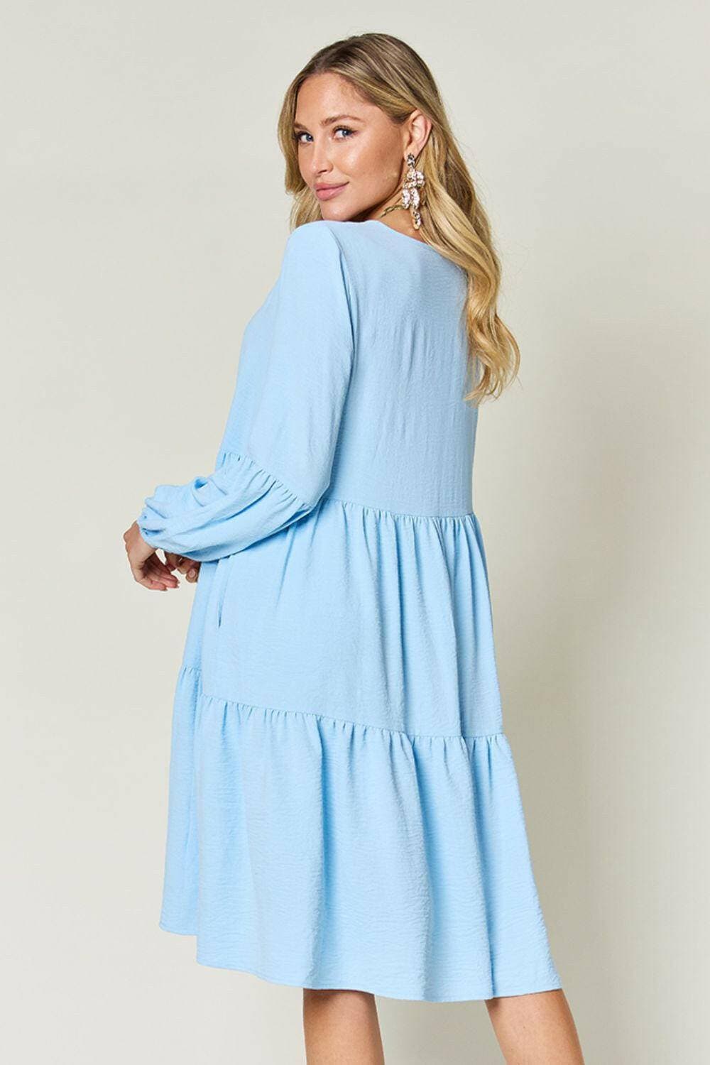 Double Vision V-Neck Balloon Sleeve Tiered DressDouble Vision V-Neck Balloon Sleeve Tiered Dress
 Step into the spotlight with our Double Vision V-Neck Balloon Sleeve Tiered Dress, a masterpiece designed to turn hLove Salve -Neck Balloon Sleeve Tiered DressColor