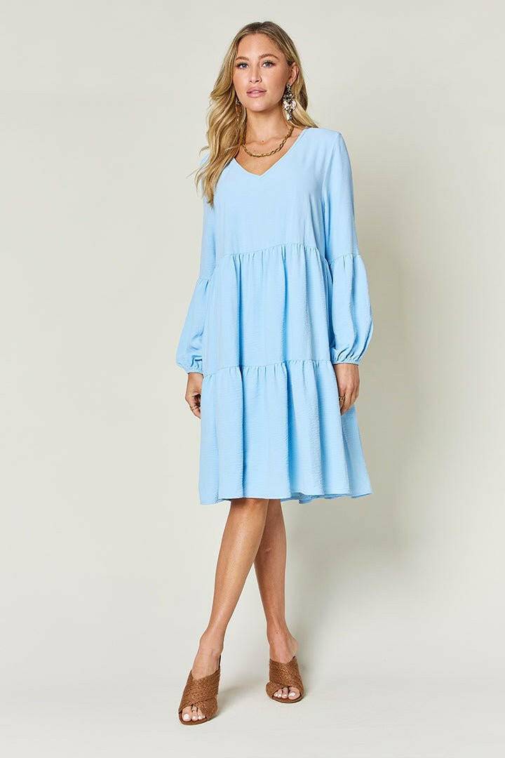 Double Vision V-Neck Balloon Sleeve Tiered DressDouble Vision V-Neck Balloon Sleeve Tiered Dress
 Step into the spotlight with our Double Vision V-Neck Balloon Sleeve Tiered Dress, a masterpiece designed to turn hLove Salve -Neck Balloon Sleeve Tiered DressColor