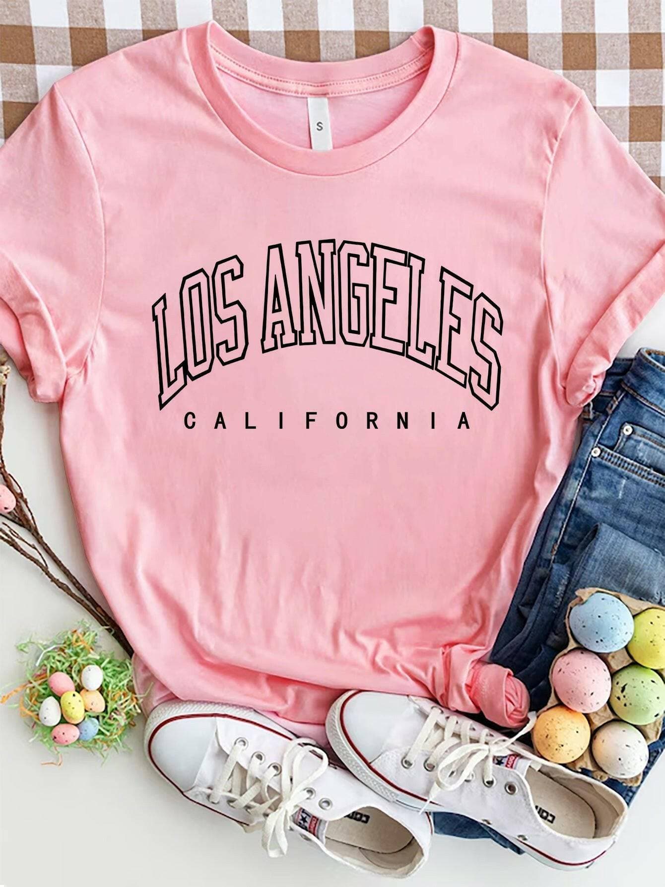 City of Angels California Round Neck TeeCity of Angels California Round Neck Tee
 Upgrade your style game with the City of Angels California Round Neck Tee, a perfect fusion of comfort and chic. This tee iLove Salve Angels California Round Neck TeeGraphic