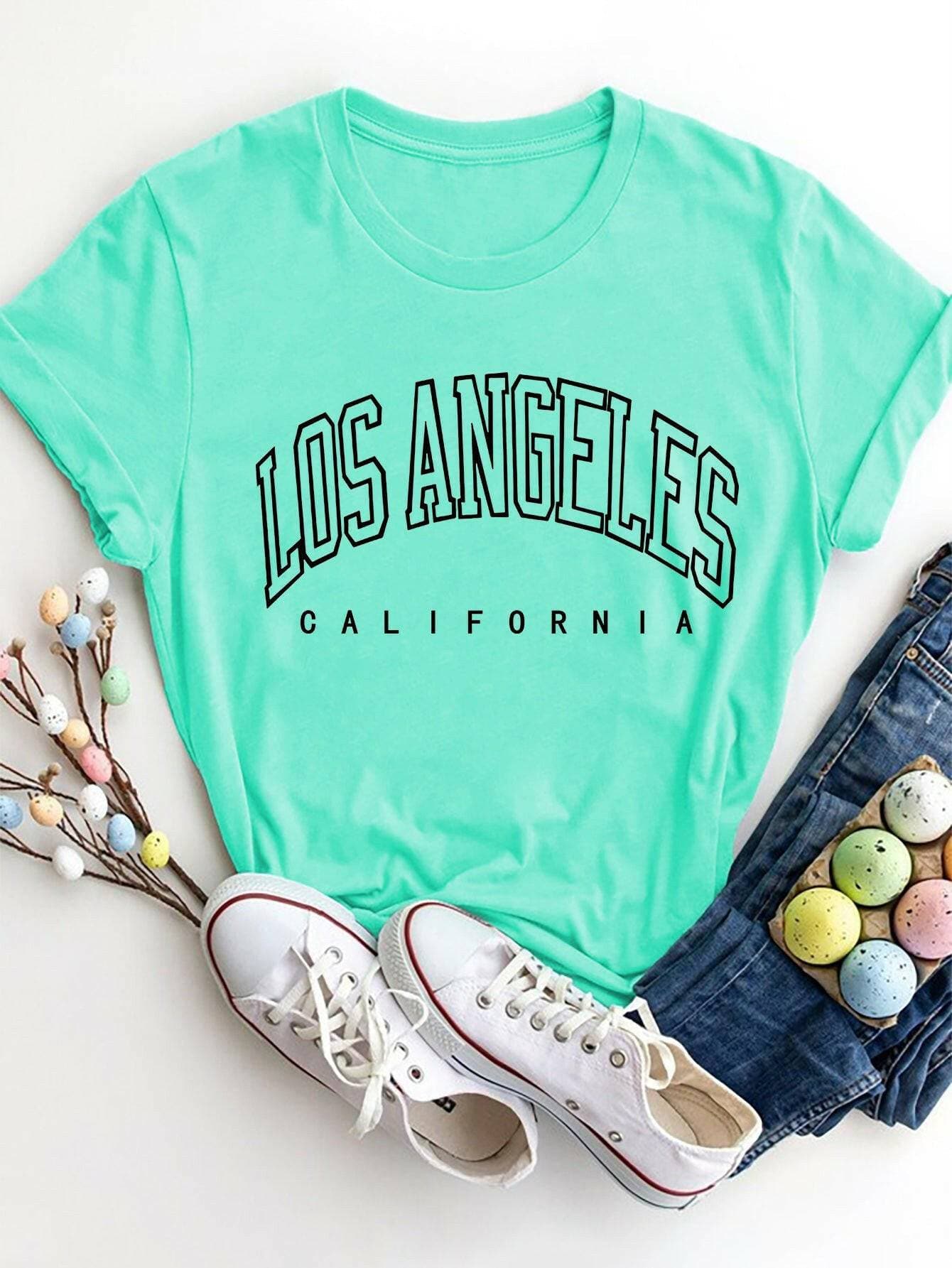 City of Angels California Round Neck TeeCity of Angels California Round Neck Tee
 Upgrade your style game with the City of Angels California Round Neck Tee, a perfect fusion of comfort and chic. This tee iLove Salve Angels California Round Neck TeeGraphic