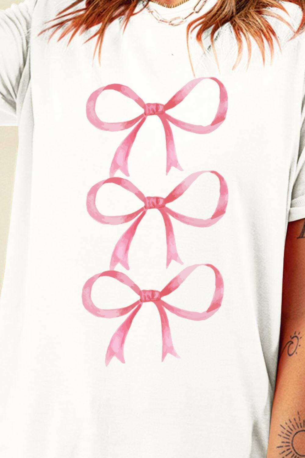 Chic Bow Print Sheer Short Sleeve TeeChic Bow Print Sheer Short Sleeve Tee
 Revamp your wardrobe effortlessly with our Chic Bow Print Sheer Short Sleeve Tee. Elevate your everyday style with this versatLove Salve Chic Bow Print Sheer Short Sleeve TeeGraphic