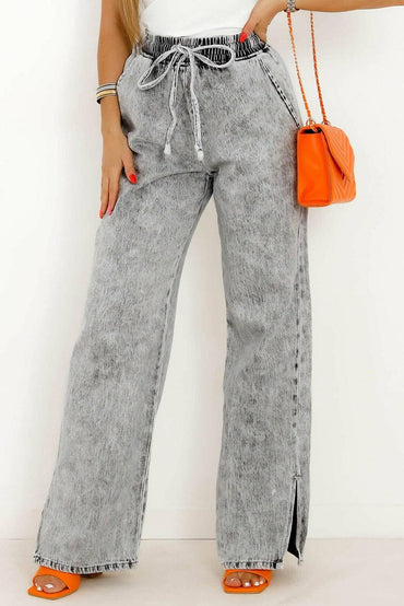 Chic drawstring jeans with stylish slit accents and pockets