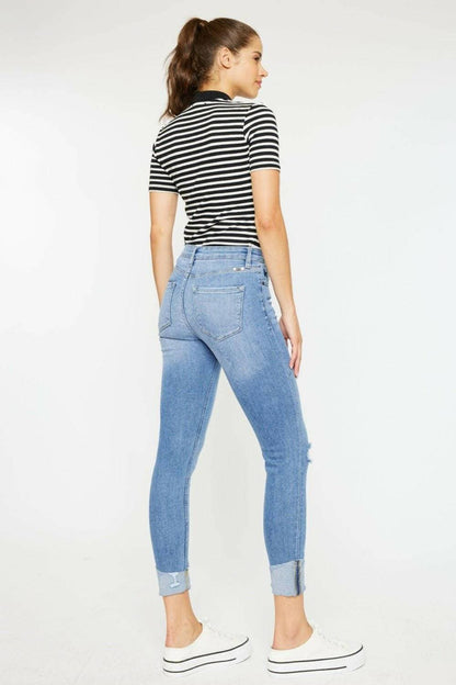 Trendy distressed denim jeans with retro button fly