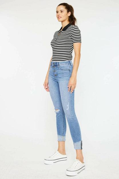 Trendy distressed denim jeans with retro button fly