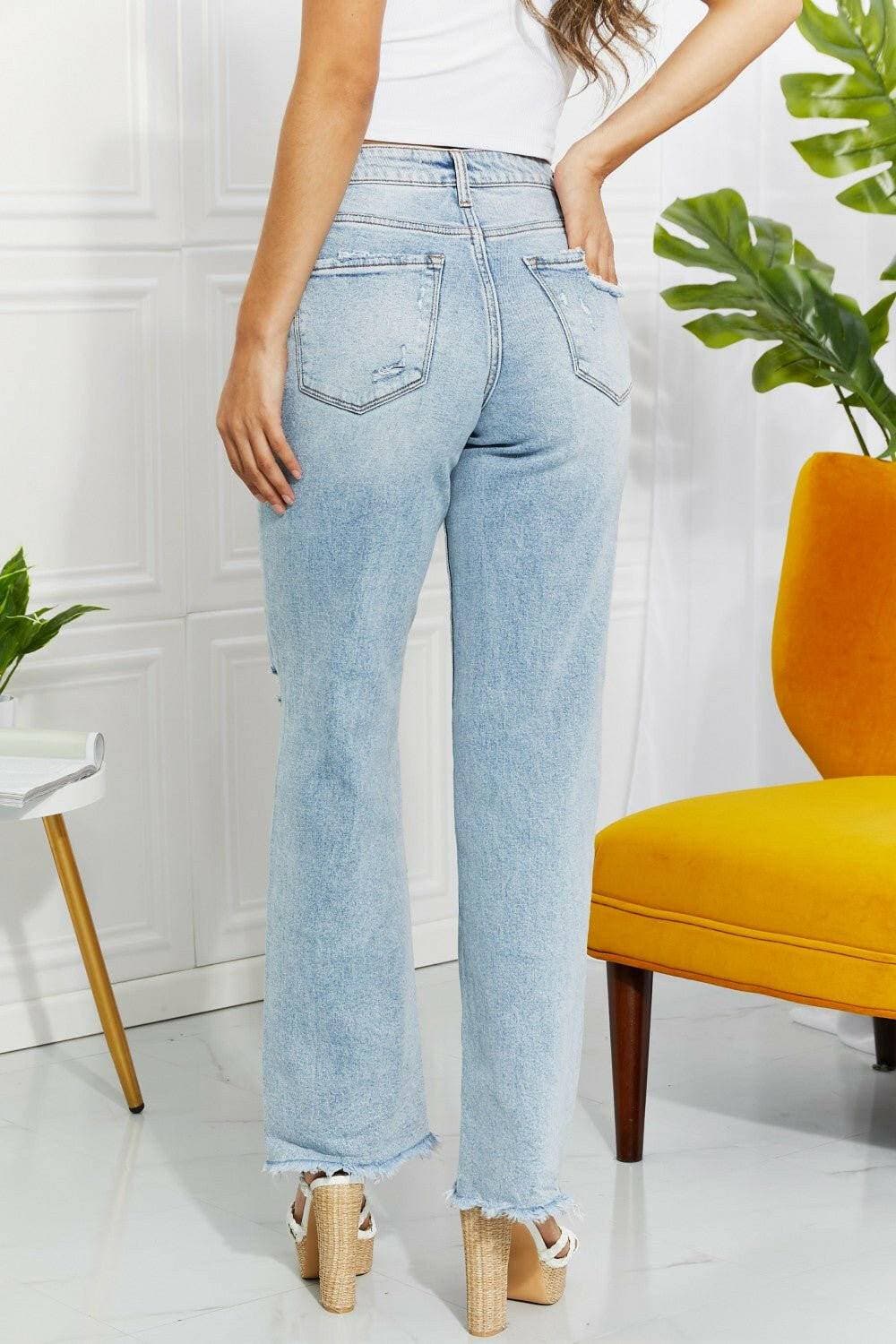 Nostalgic 90's light wash straight leg jeans with distressed details