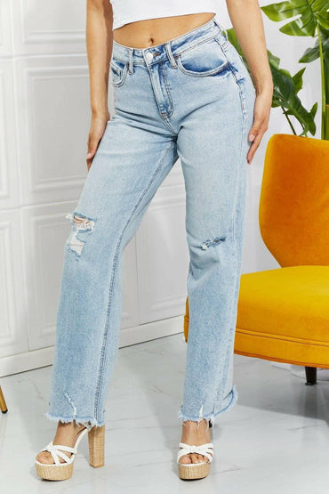 Nostalgic 90's light wash straight leg jeans with distressed details