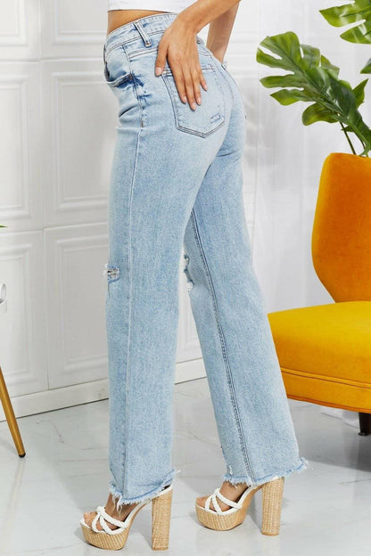 Nostalgic 90's light wash straight leg jeans with distressed details