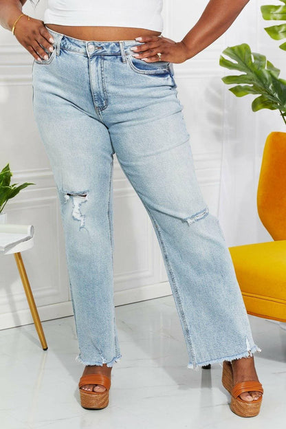 Nostalgic 90's light wash straight leg jeans with distressed details