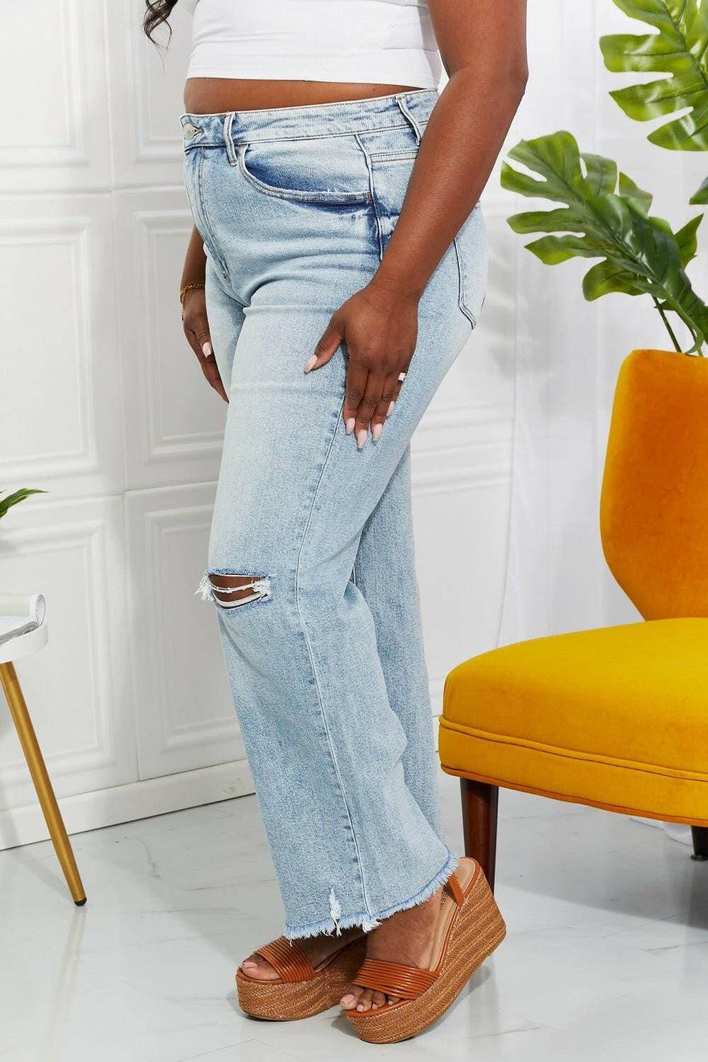 Nostalgic 90's light wash straight leg jeans with distressed details