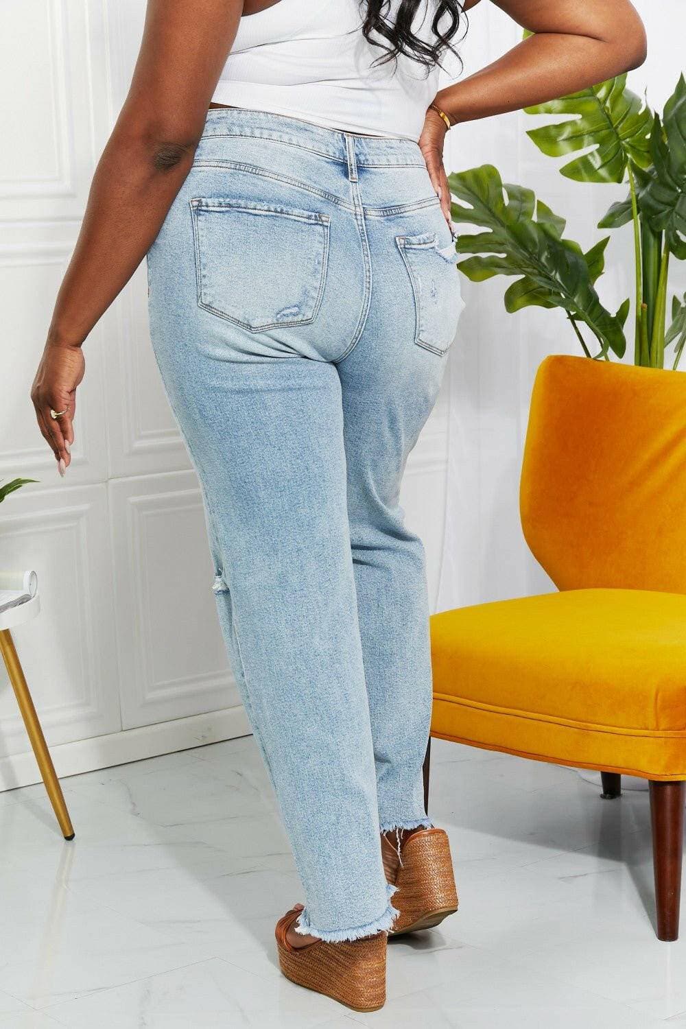 Nostalgic 90's light wash straight leg jeans with distressed details