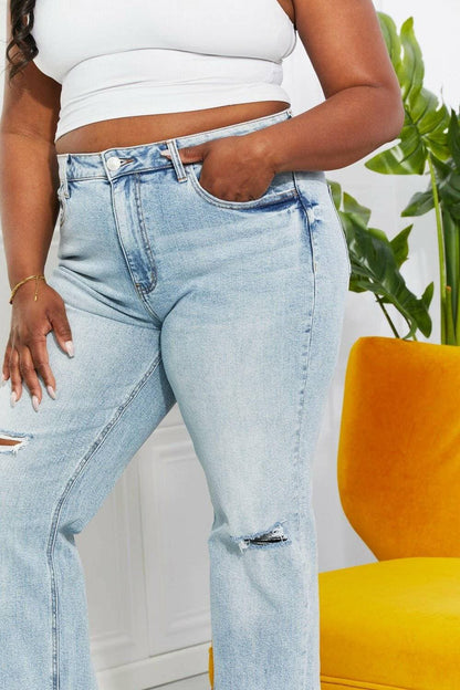 Nostalgic 90's light wash straight leg jeans with distressed details