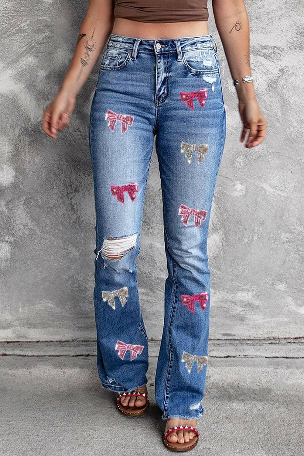 Sequin Spark Distressed Bootcut JeansSequin Spark Distressed Bootcut Jeans

Elevate your denim wardrobe with our Sequin Spark Distressed Bootcut Jeans. These jeans are not just a piece of clothing; theyLove Salve Sequin Spark Distressed Bootcut Jeansjeans