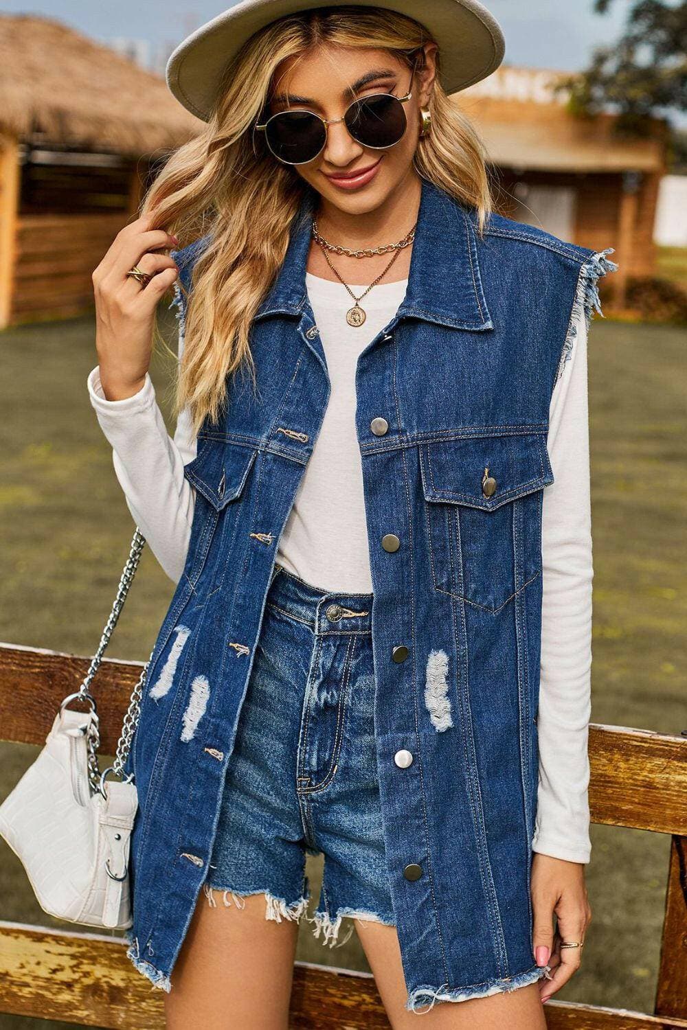 Stylish distressed denim sleeveless top with cowgirl vibes