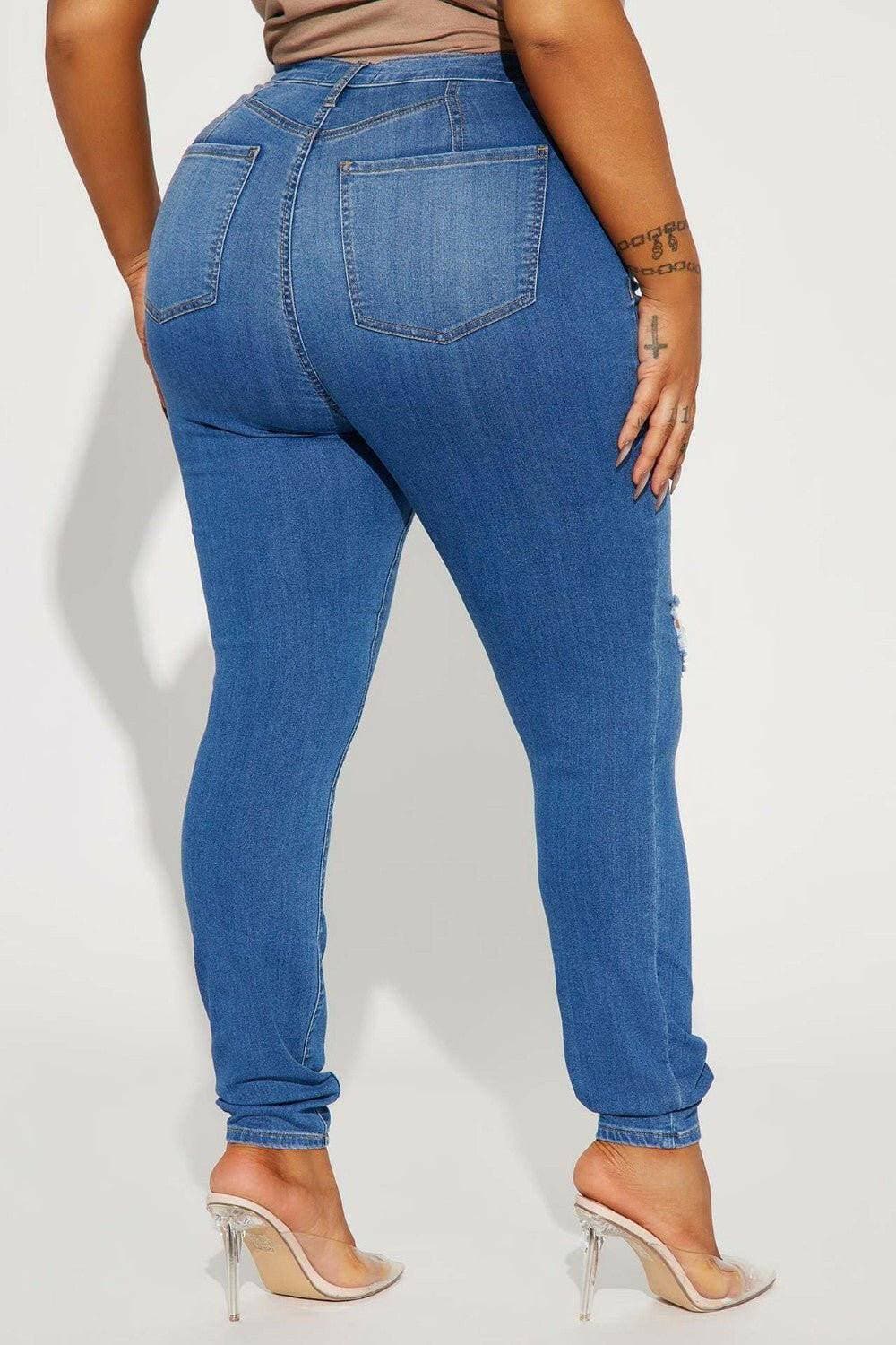 Distressed Denim Jeans with Button Detailing and PocketsUpgrade Your Style with Distressed Denim Jeans

Elevate your fashion game with our Distressed Denim Jeans, designed to turn heads with their unique button detailing Love Salve Distressed Denim Jeansjeans