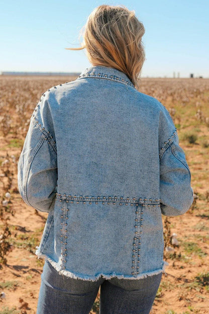 Edgy studded denim jacket with raw hem and button detail