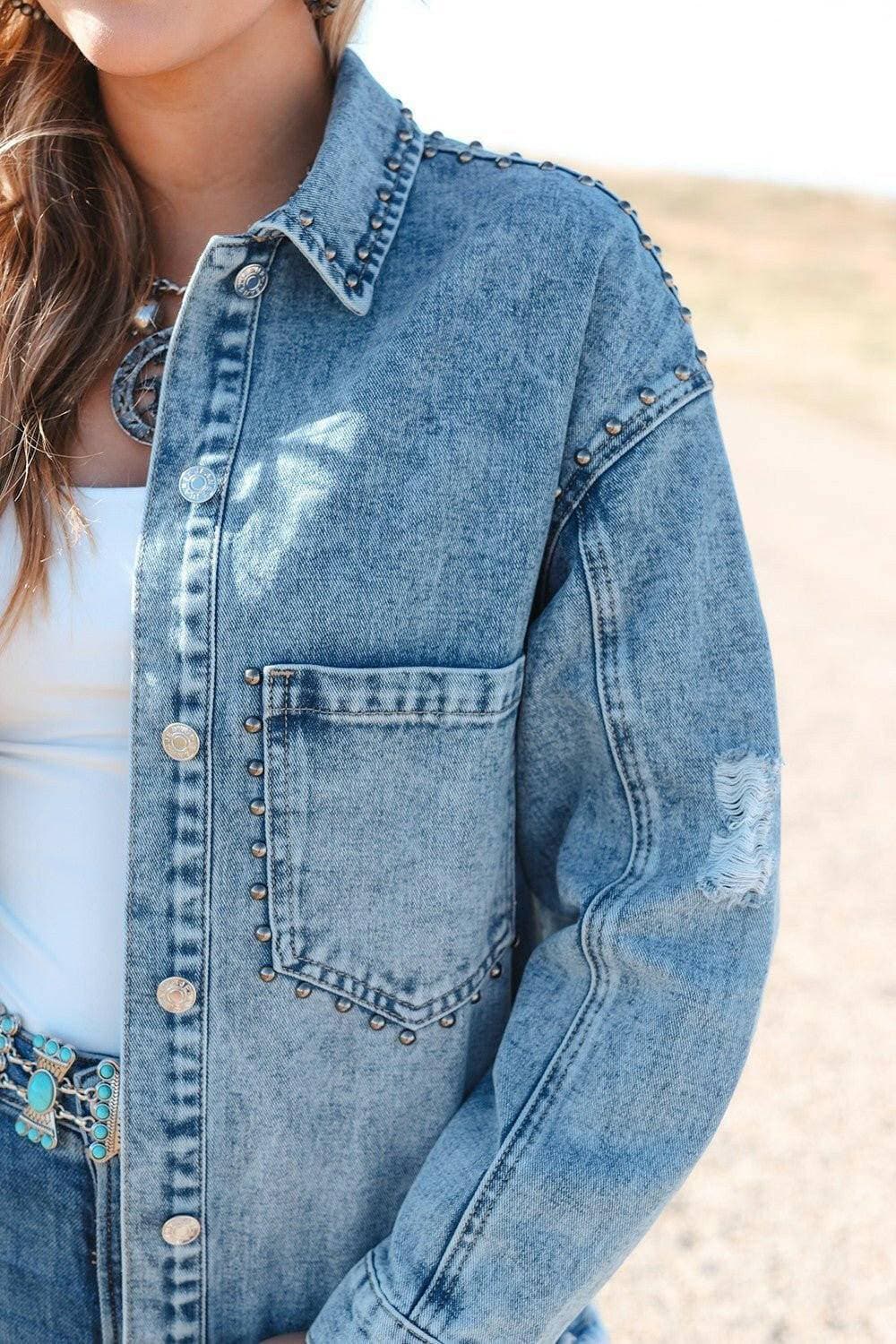 Edgy studded denim jacket with raw hem and button detail