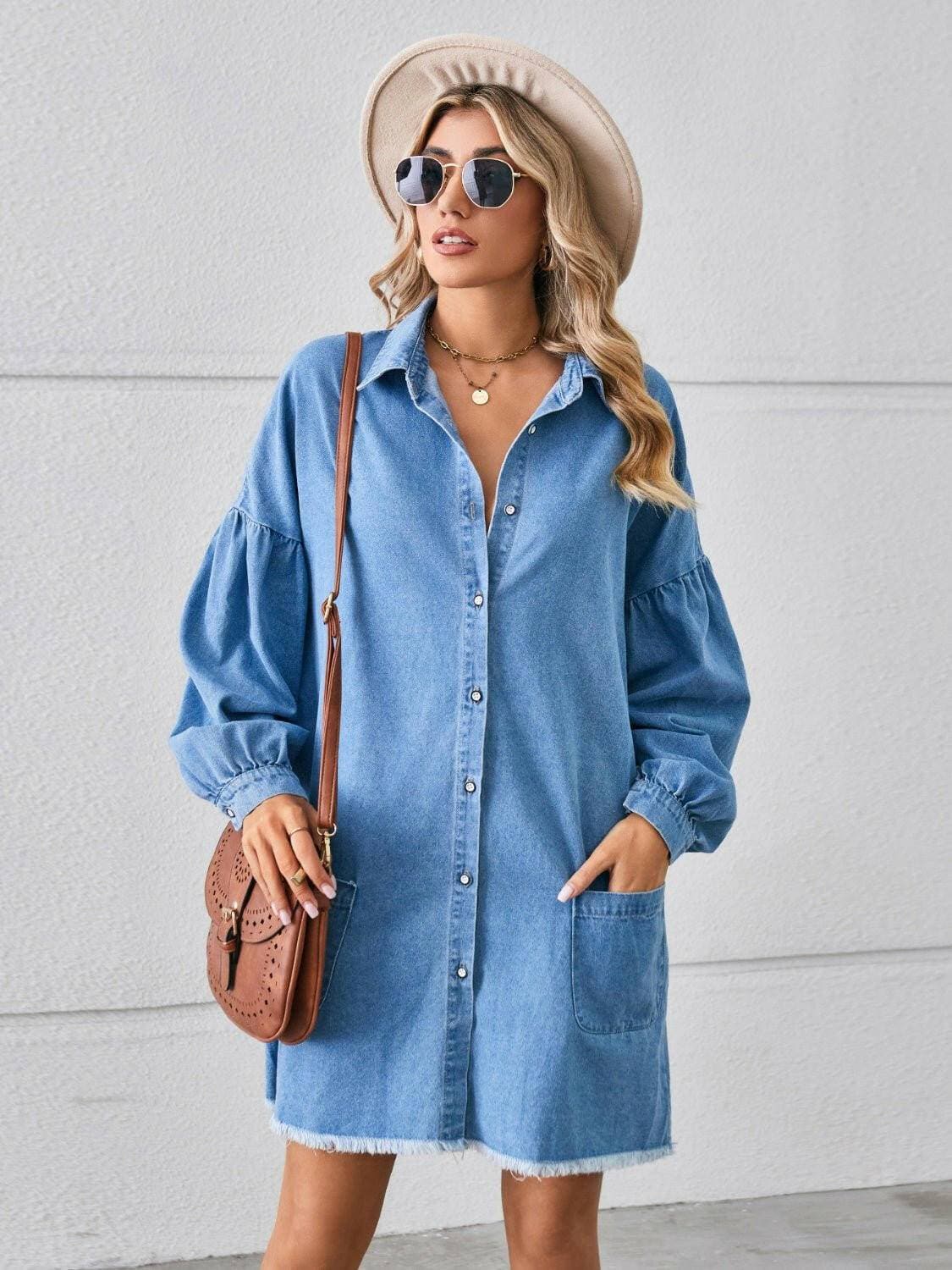 Chic denim shirt dress with pockets and button-up front, featuring a distressed hem.