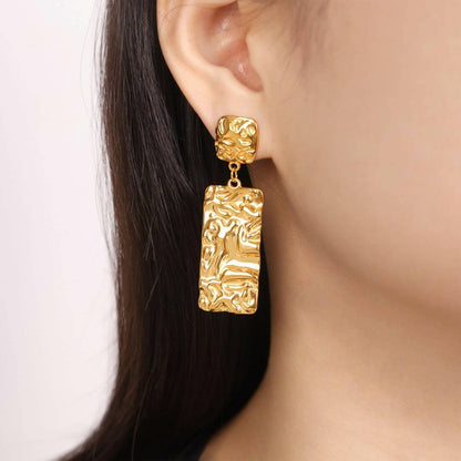 Bold Gold-Plated Geometric Statement EarringsBold Gold-Plated Geometric Statement Earrings
 
 
Materials: Crafted from durable titanium steel with a stunning gold-plated finish
 
Unique Design: Textured geometrLove Salve Bold Gold-Plated Geometric Statement EarringsJewelry