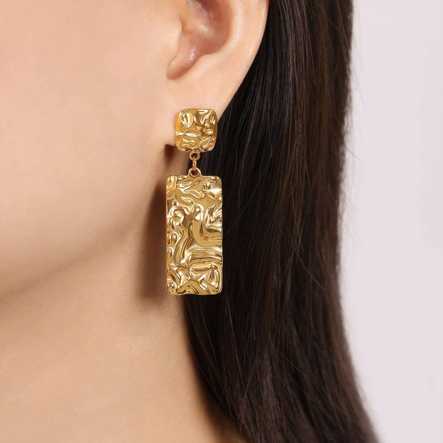 Bold Gold-Plated Geometric Statement EarringsBold Gold-Plated Geometric Statement Earrings
 
 
Materials: Crafted from durable titanium steel with a stunning gold-plated finish
 
Unique Design: Textured geometrLove Salve Bold Gold-Plated Geometric Statement EarringsJewelry