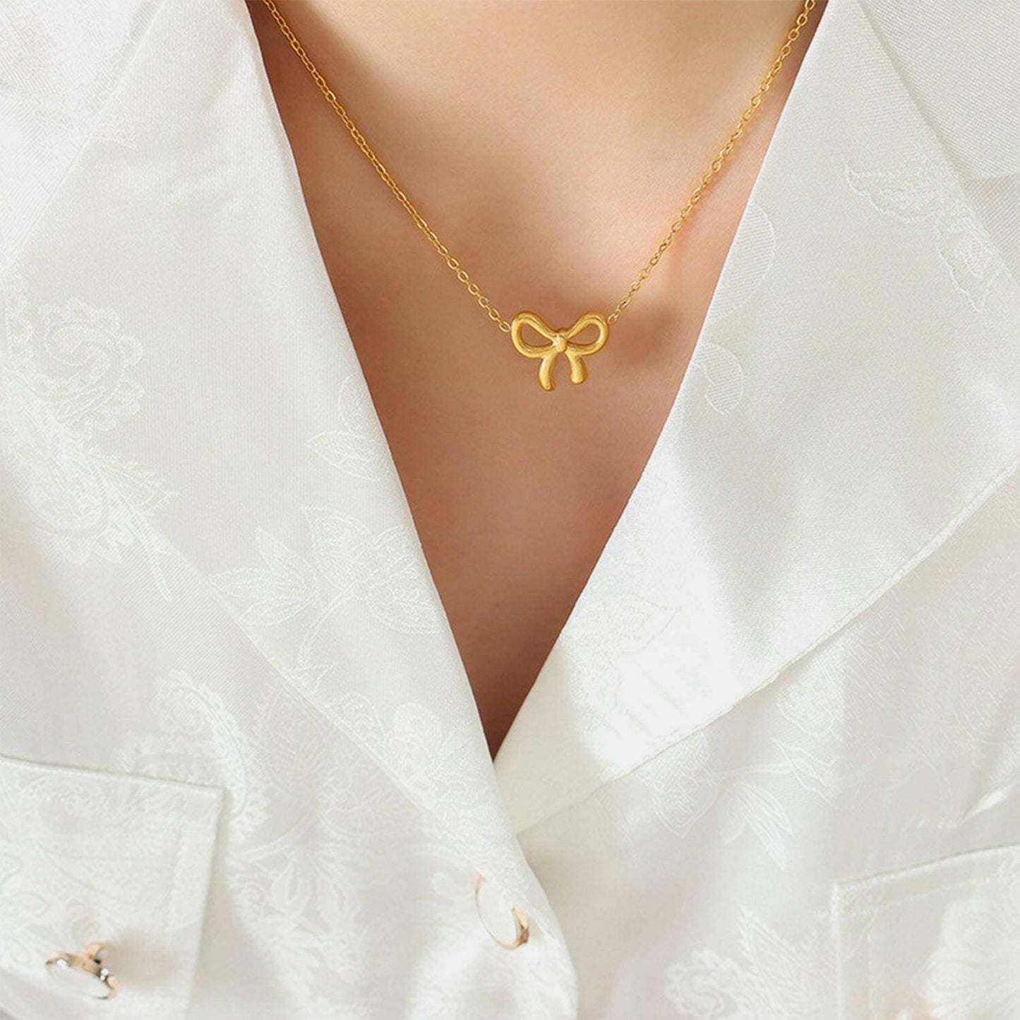 Elegant Gold Bow Necklace: Stylish Titanium Steel Fashion AccessoryElegant Gold Bow Necklace: Stylish Titanium Steel Fashion Accessory
 Indulge in Effortless Sophistication with our Elegant Gold Bow Necklace, a Stylish Titanium SteeLove Salve Stylish Titanium Steel Fashion AccessoryJewelry