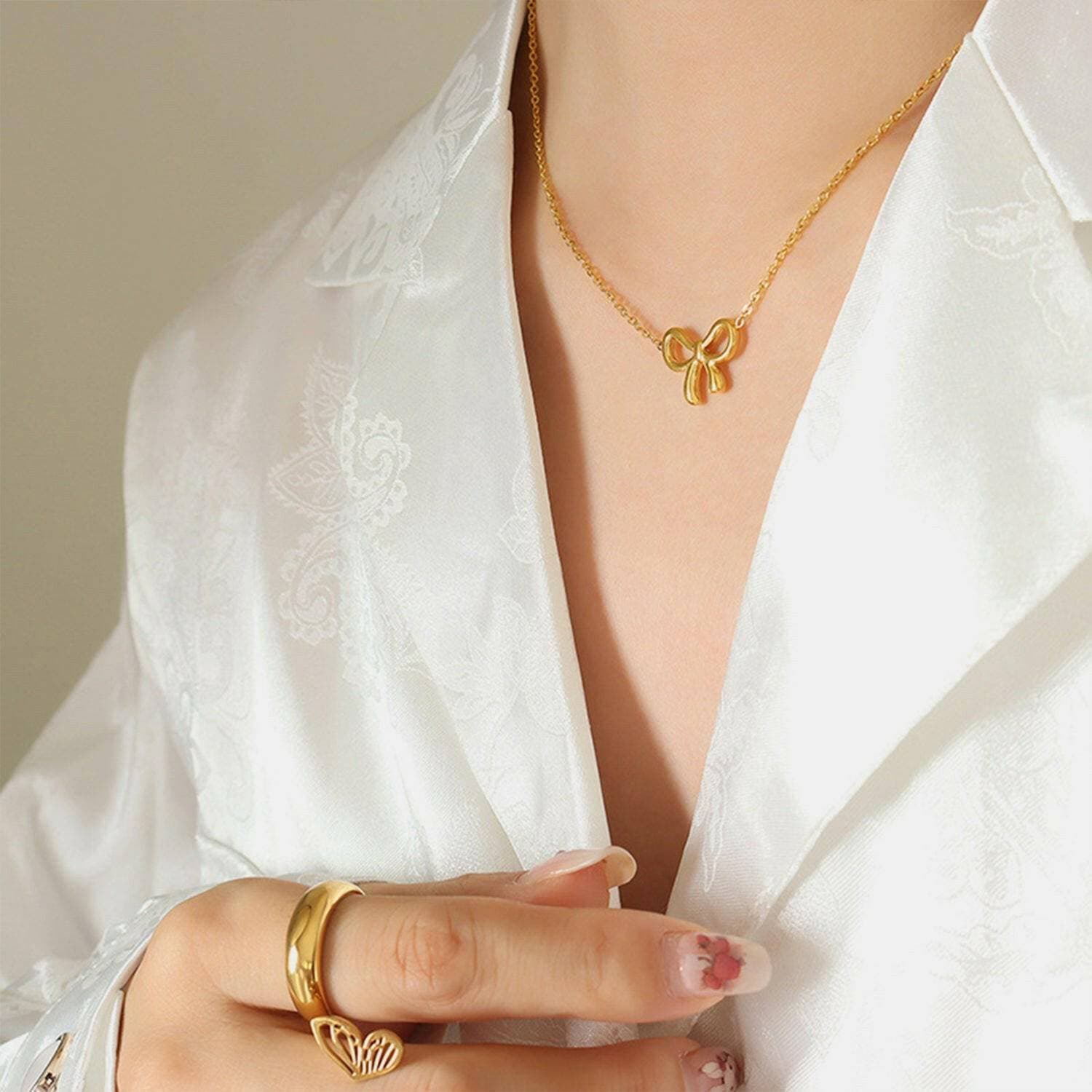 Elegant Gold Bow Necklace: Stylish Titanium Steel Fashion AccessoryElegant Gold Bow Necklace: Stylish Titanium Steel Fashion Accessory
 Indulge in Effortless Sophistication with our Elegant Gold Bow Necklace, a Stylish Titanium SteeLove Salve Stylish Titanium Steel Fashion AccessoryJewelry