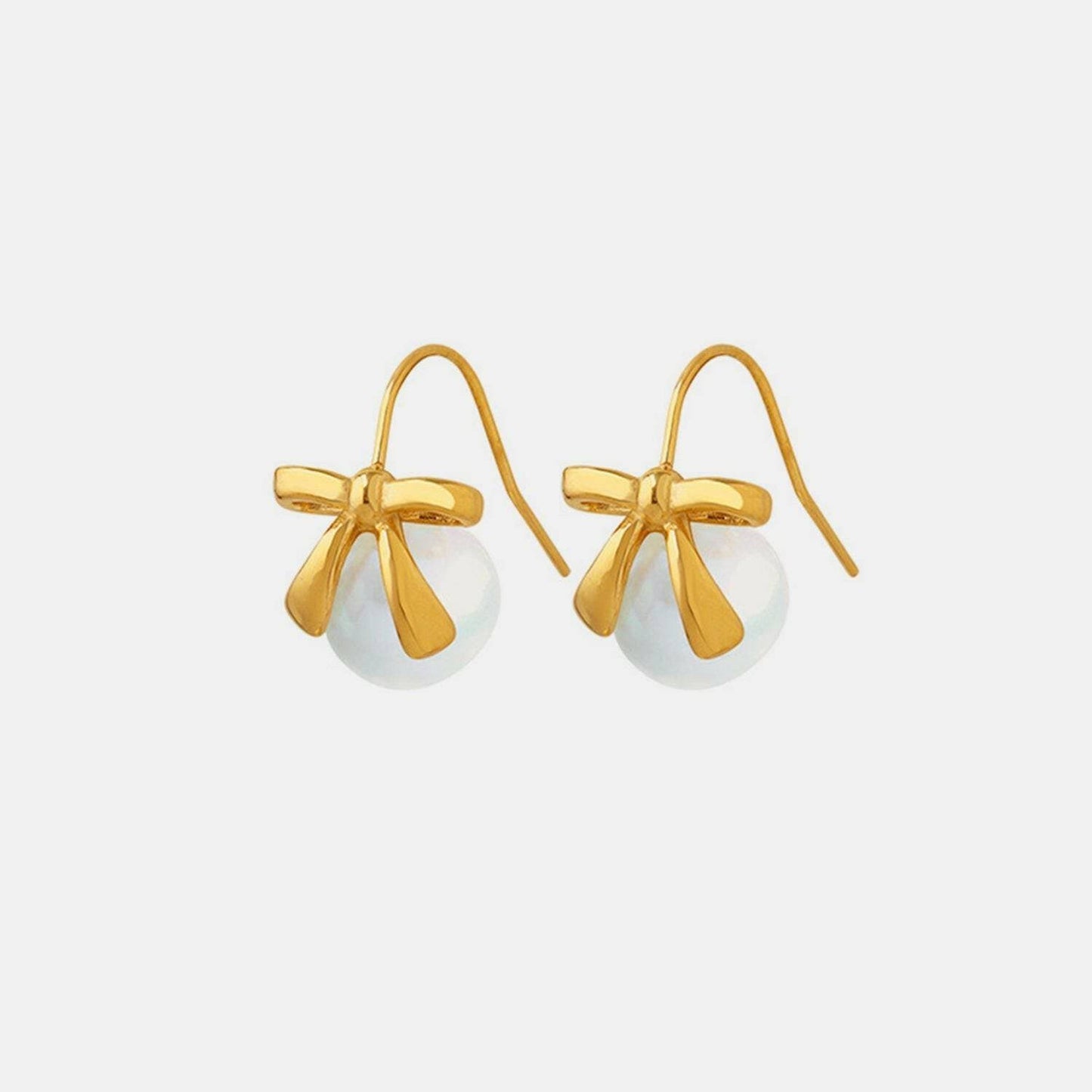 Charming golden bow drop earrings with elegant glass accents