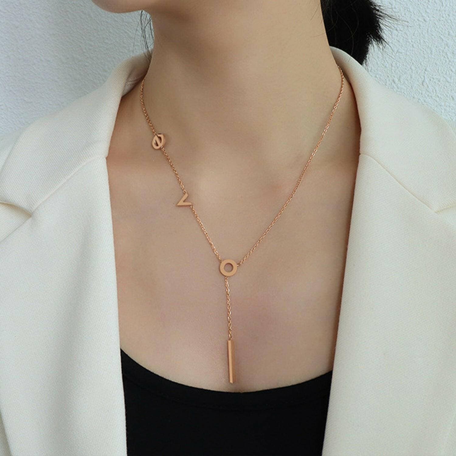 Rose Gold-Plated Titanium Steel Monogram Pendant NecklaceIntroducing the Rose Gold-Plated Titanium Steel Monogram Pendant Necklace
 Indulge in sophistication with our exquisite 18K rose gold-plated titanium steel necklace.Love Salve Rose Gold-Plated Titanium Steel Monogram Pendant NecklaceJewelry