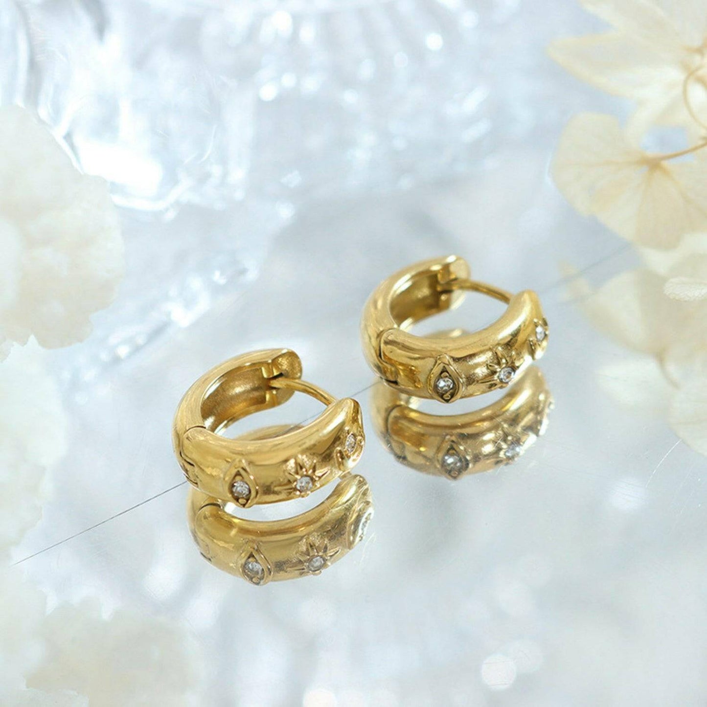 Zircon-encrusted titanium steel huggie earrings with golden elegance