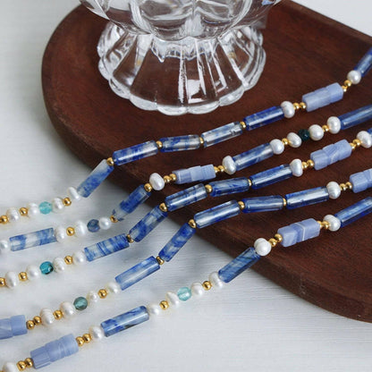 Chic blue chalcedony necklace with geometric design, featuring freshwater pearls and gold-plated titanium steel.