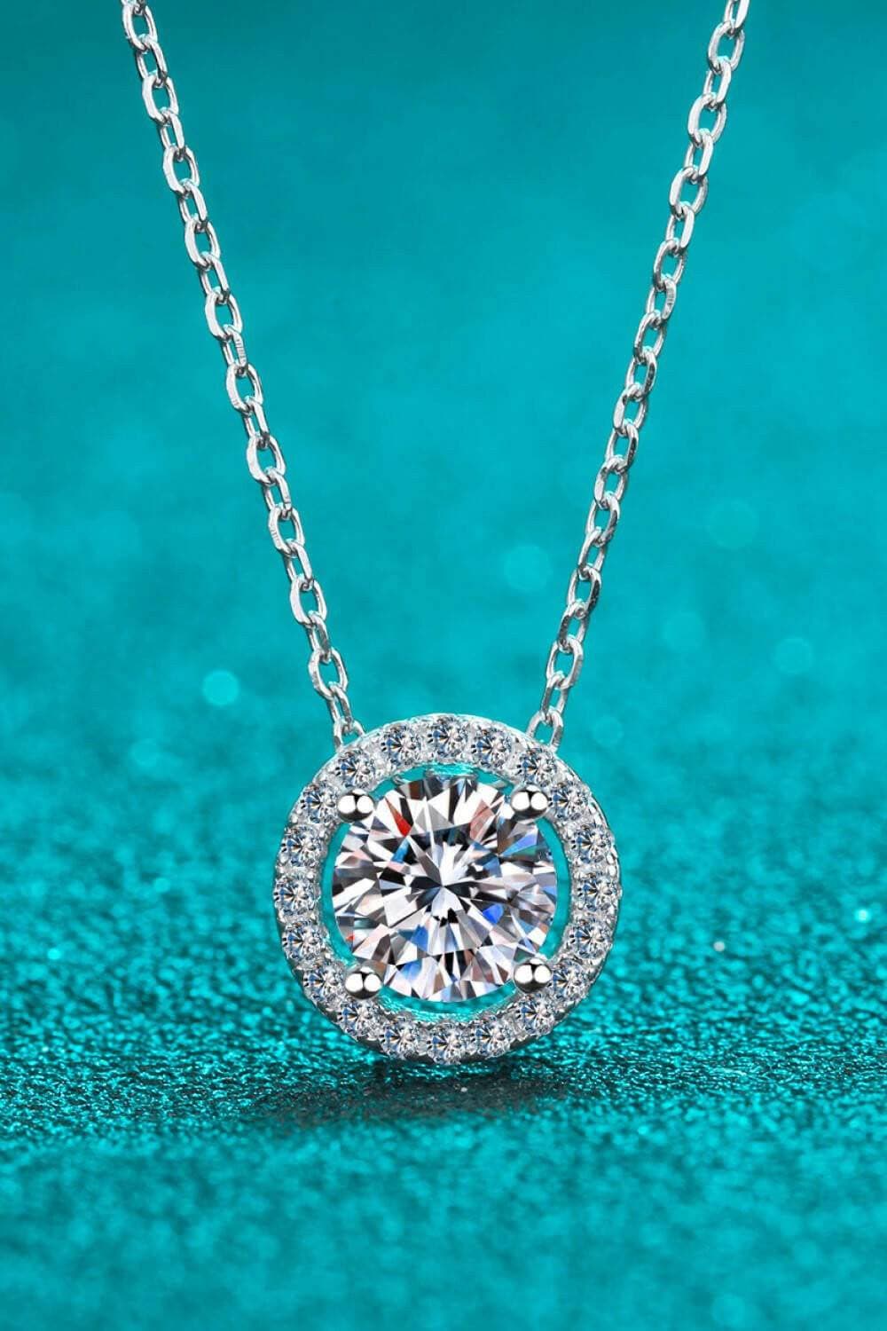 1 Carat Moissanite Round Pendant Necklace in Sterling Silver - SparkliExperience Timeless Elegance with our 1 Carat Moissanite Round Pendant Necklace
 
 
Certified Brilliance: Featuring a stunning Moissanite stone over 0.3 carats, thisLove Salve 1 Carat Moissanite Round Pendant NecklaceJewelry