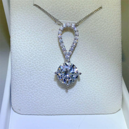 Luxurious 5 Carat Sterling Silver Teardrop Necklace Embellished with MExperience Elegance with our Luxurious Teardrop Necklace
 
 Embellished with a dazzling 5 carat moissanite stone
 Crafted from high-quality 925 sterling silver for eLove Salve Luxurious 5 Carat Sterling Silver Teardrop Necklace EmbellishedJewelry