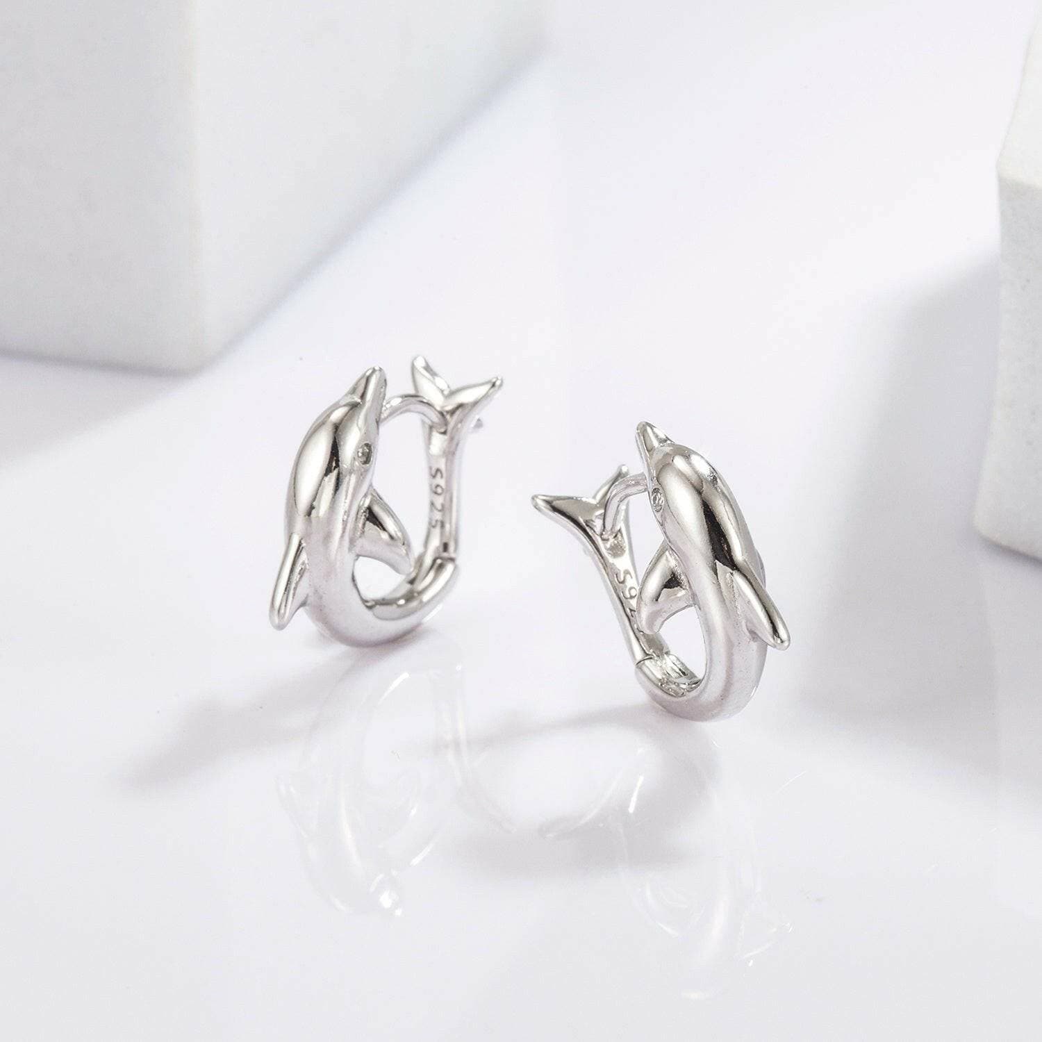 Playful Dolphin Zircon Earrings in 925 Sterling Silver with MaintenancPlayful Dolphin Zircon Earrings in 925 Sterling Silver with Maintenance Tips
 Indulge in the whimsical allure of the ocean with our Playful Dolphin Zircon Earrings, Love Salve Playful Dolphin Zircon EarringsJewelry