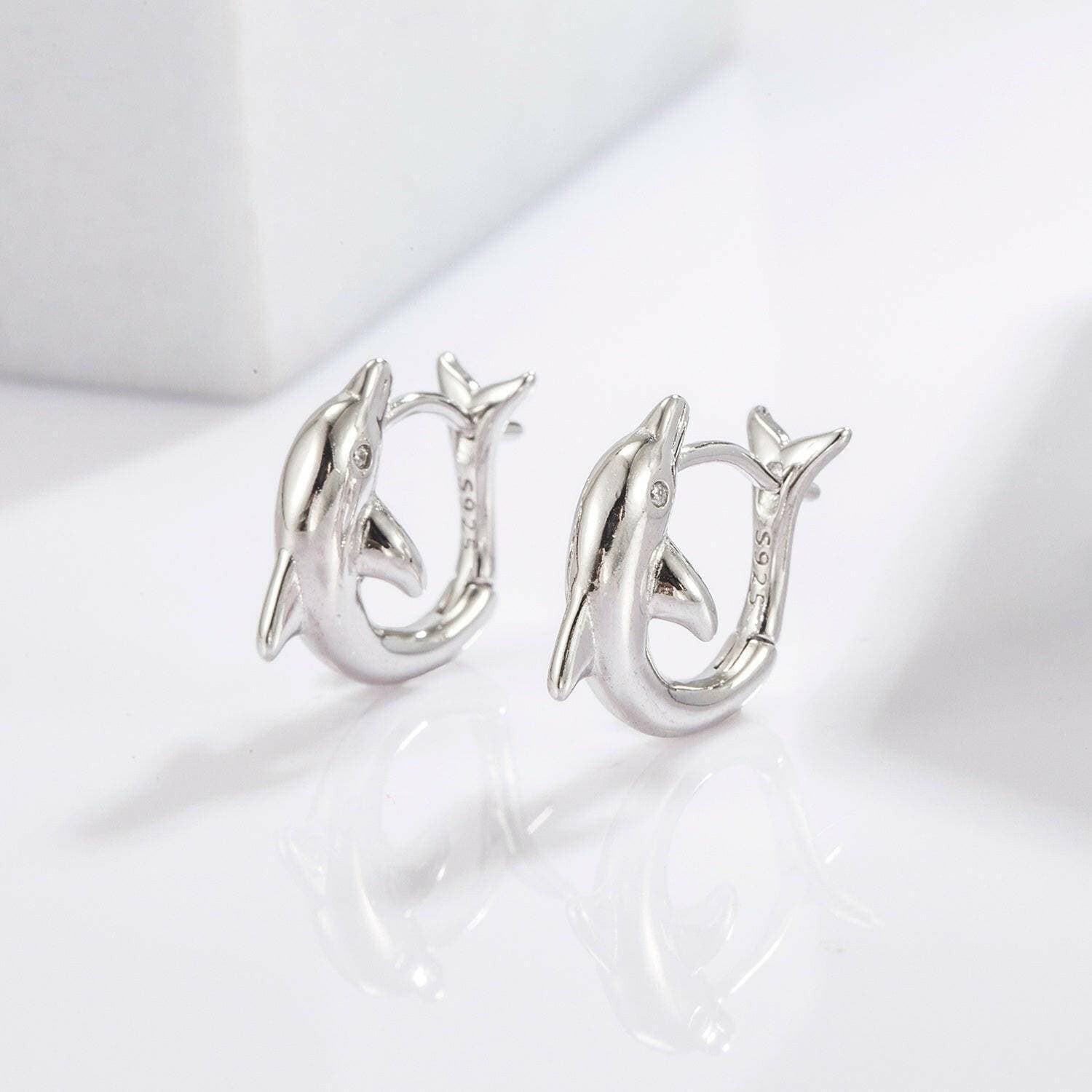 Playful Dolphin Zircon Earrings in 925 Sterling Silver with MaintenancPlayful Dolphin Zircon Earrings in 925 Sterling Silver with Maintenance Tips
 Indulge in the whimsical allure of the ocean with our Playful Dolphin Zircon Earrings, Love Salve Playful Dolphin Zircon EarringsJewelry