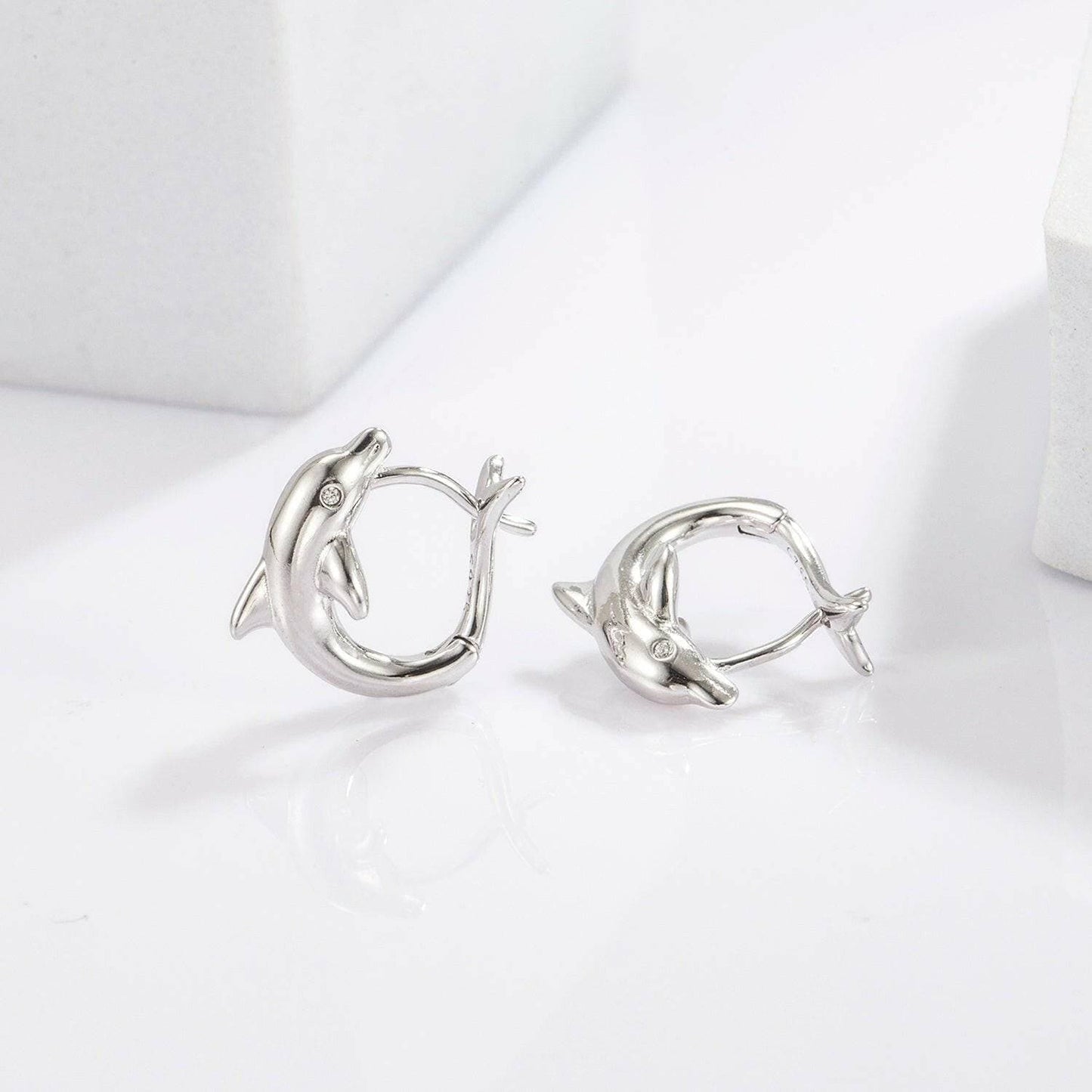 Playful Dolphin Zircon Earrings in 925 Sterling Silver with MaintenancPlayful Dolphin Zircon Earrings in 925 Sterling Silver with Maintenance Tips
 Indulge in the whimsical allure of the ocean with our Playful Dolphin Zircon Earrings, Love Salve Playful Dolphin Zircon EarringsJewelry