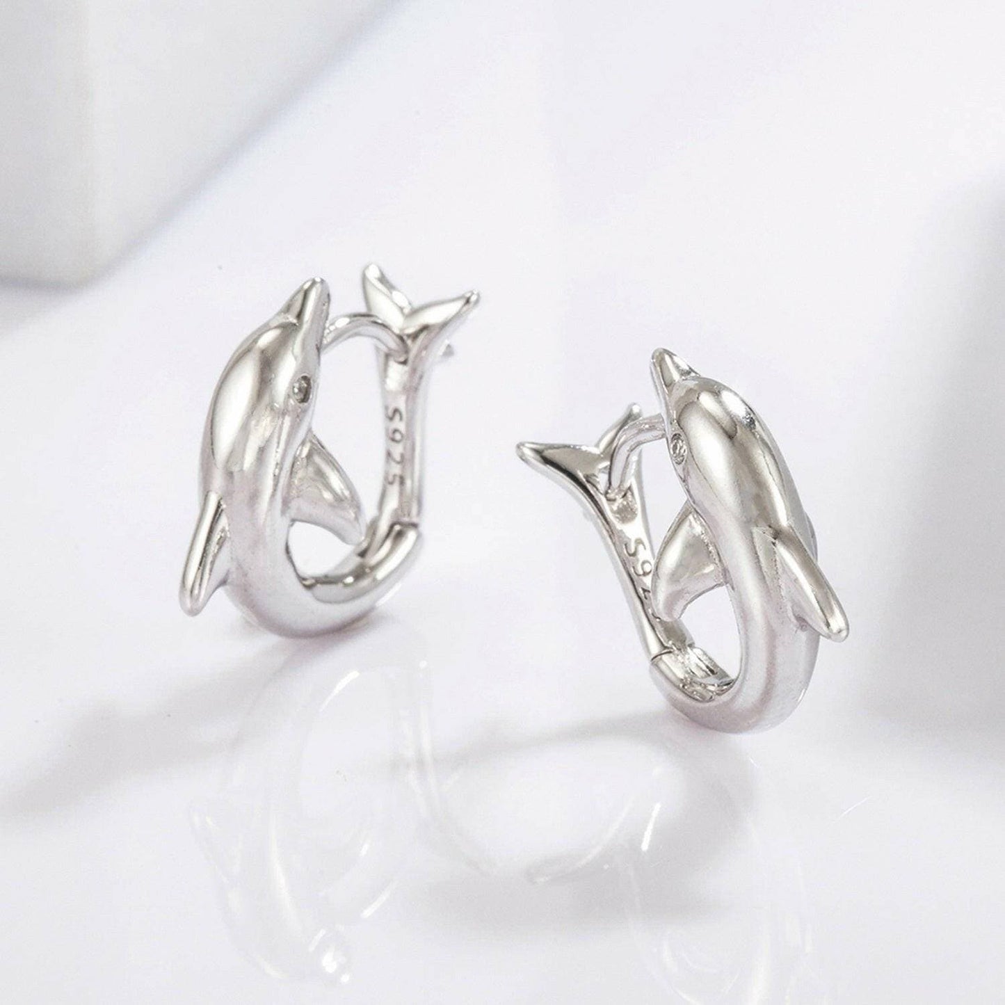 Playful Dolphin Zircon Earrings in 925 Sterling Silver with MaintenancPlayful Dolphin Zircon Earrings in 925 Sterling Silver with Maintenance Tips
 Indulge in the whimsical allure of the ocean with our Playful Dolphin Zircon Earrings, Love Salve Playful Dolphin Zircon EarringsJewelry