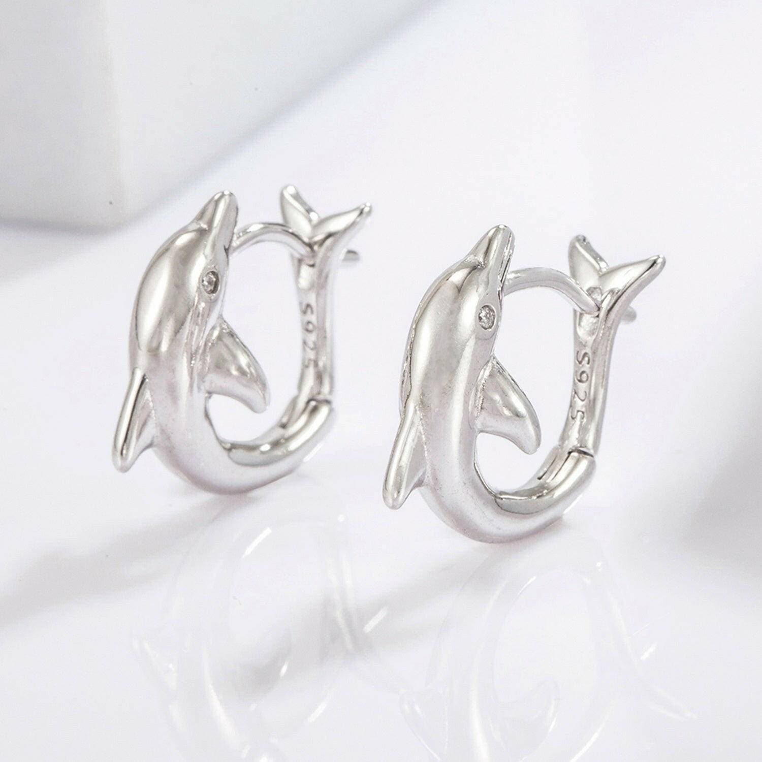 Playful Dolphin Zircon Earrings in 925 Sterling Silver with MaintenancPlayful Dolphin Zircon Earrings in 925 Sterling Silver with Maintenance Tips
 Indulge in the whimsical allure of the ocean with our Playful Dolphin Zircon Earrings, Love Salve Playful Dolphin Zircon EarringsJewelry