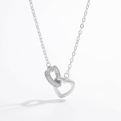 Zircon-encrusted heart pendant in sterling silver with elegant craftsmanship