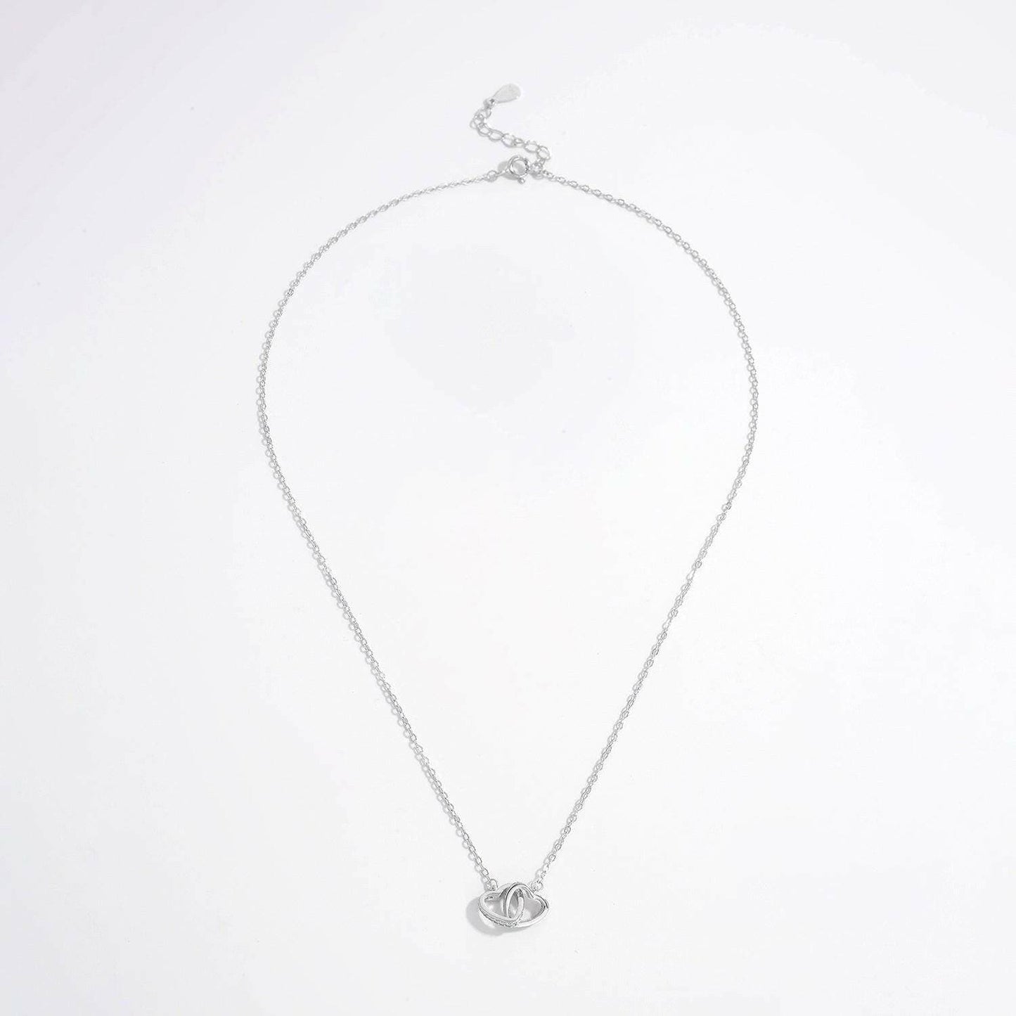 Zircon-encrusted heart pendant in sterling silver with elegant craftsmanship