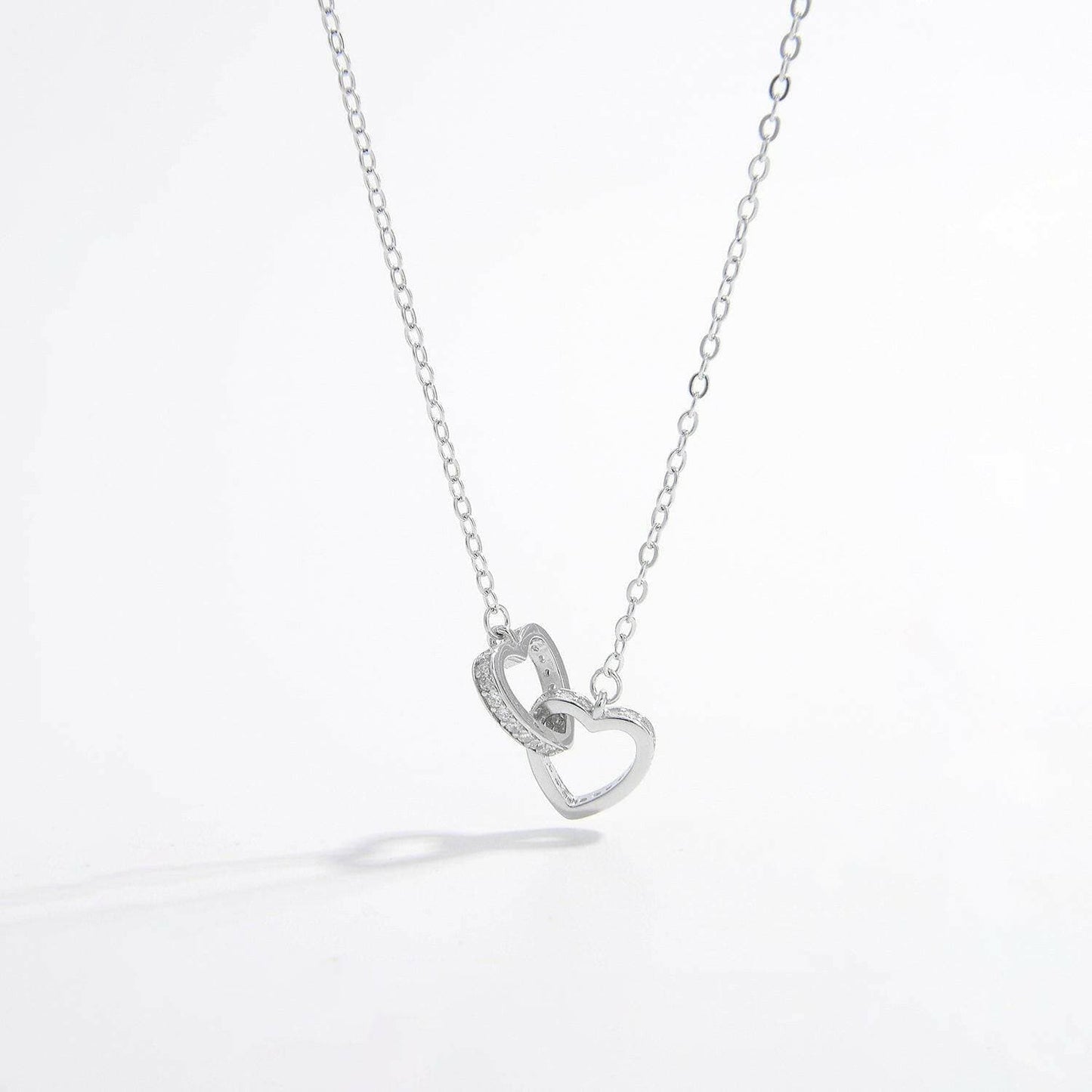 Zircon-encrusted heart pendant in sterling silver with elegant craftsmanship