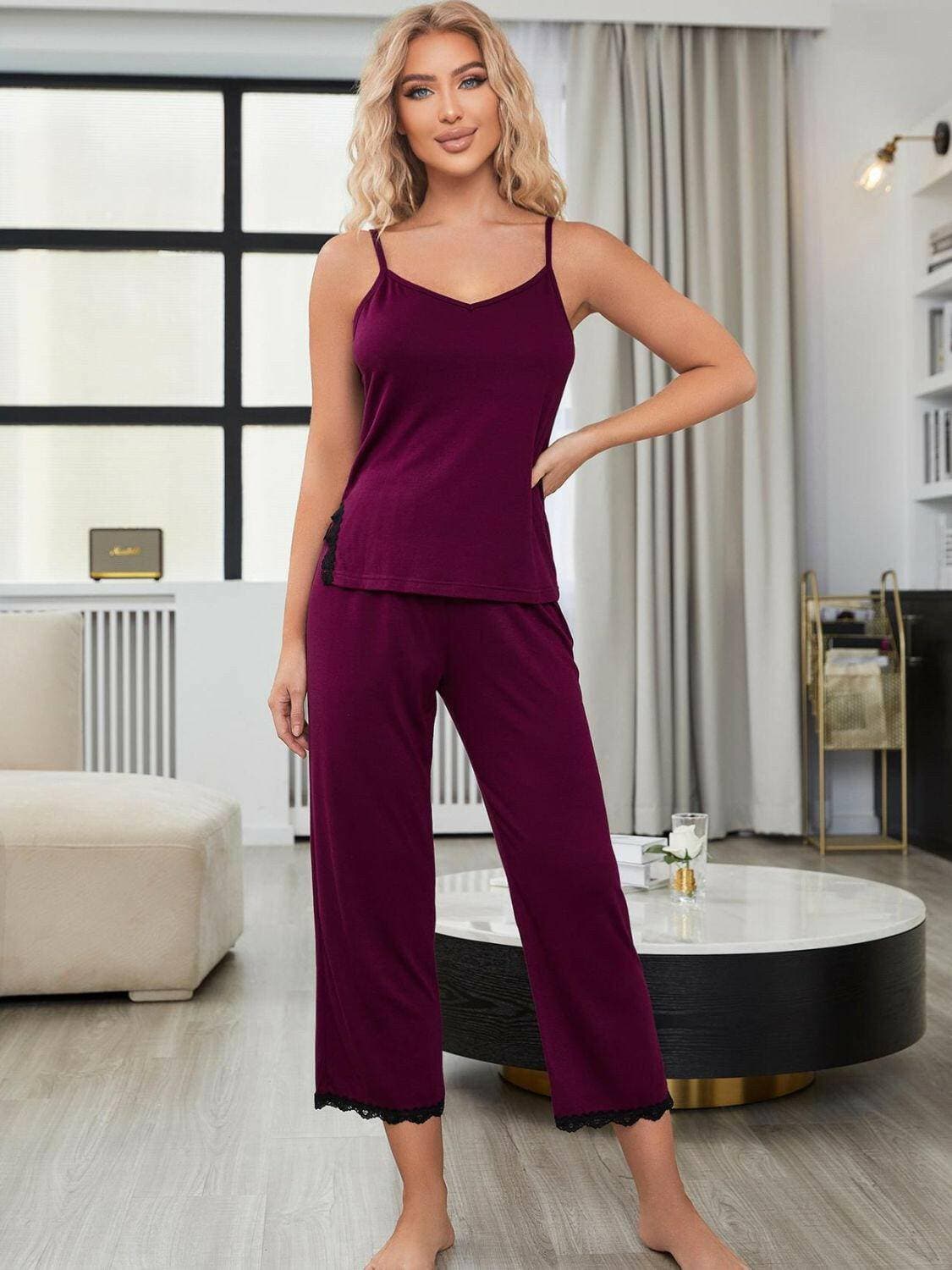 Elegant lace-trimmed v-neck pajama set in rich purple color with sleeveless cami and split pants.