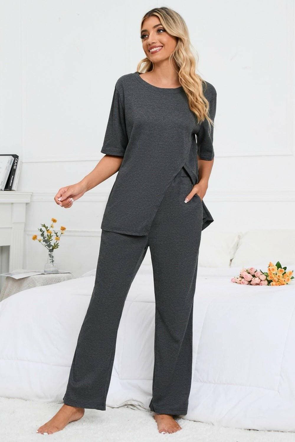 Elevate Your Loungewear Game with Coordinated Slit Neck Lounge SetElevate Your Loungewear Game with Coordinated Slit Neck Lounge Set
 Upgrade your loungewear collection with our Slit Round Neck Top and Pants Lounge Set. Embrace comLove Salve Coordinated Slit Neck Lounge Setlounge