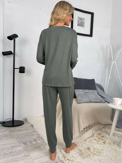 Lounge in Style: Round Neck Top and Drawstring Pants SetIndulge in Comfort and Style
 Upgrade your loungewear game with our Lounge in Style Set, featuring a chic Round Neck Top and ultra-comfortable Drawstring Pants. WhetLove Salve Round Neck Toplounge