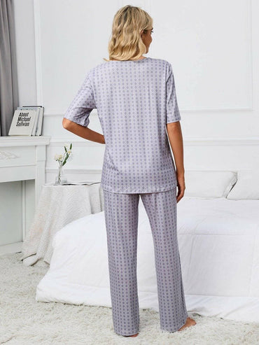 Cozy V-Neck Lounge Set with Printed Matching PantsCozy V-Neck Lounge Set with Printed Matching Pants
 Indulge in the perfect blend of comfort and style with our Cozy V-Neck Lounge Set, designed to elevate your loungLove Salve -Neck Lounge Setlounge