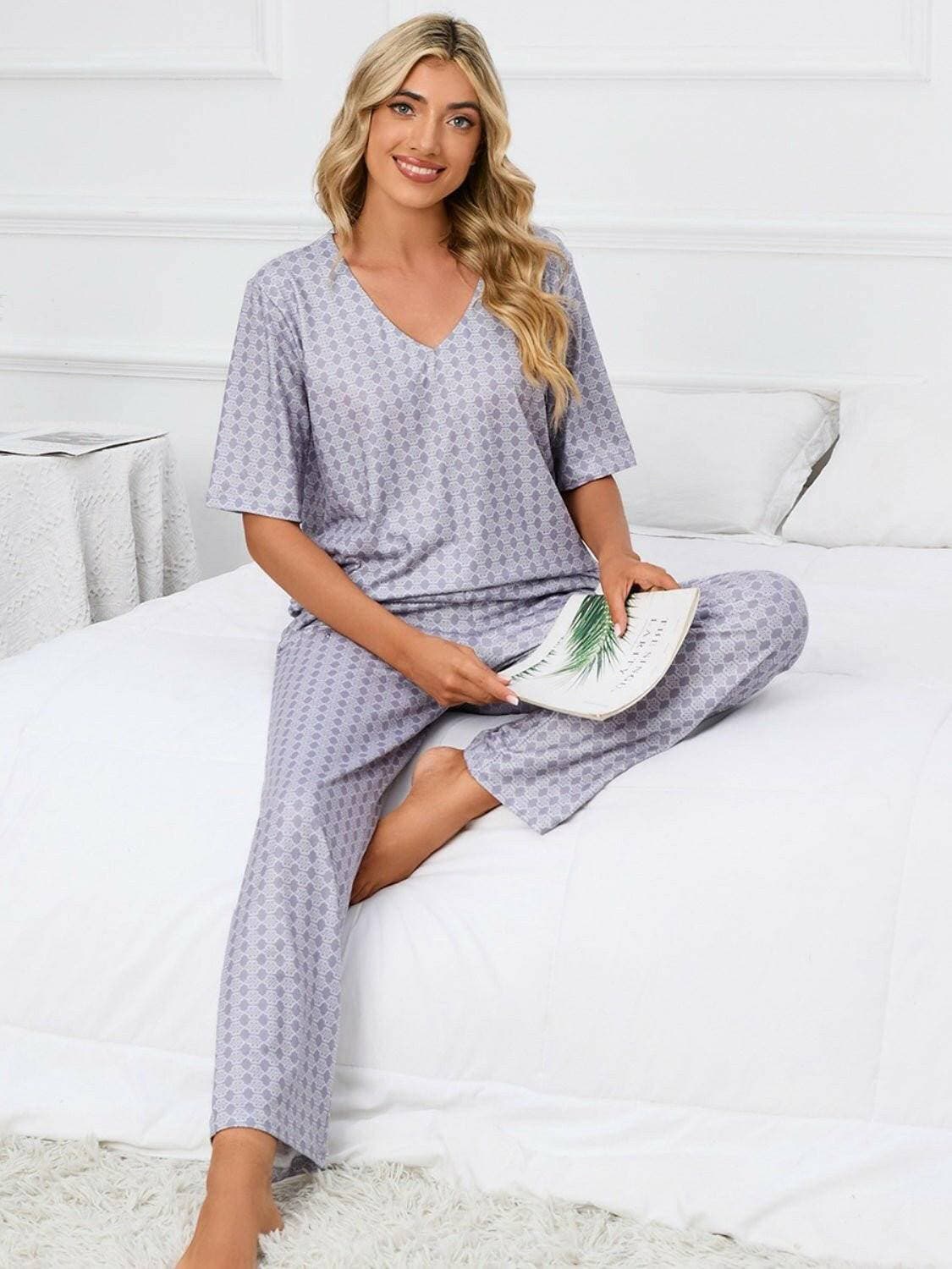 Cozy V-Neck Lounge Set with Printed Matching PantsCozy V-Neck Lounge Set with Printed Matching Pants
 Indulge in the perfect blend of comfort and style with our Cozy V-Neck Lounge Set, designed to elevate your loungLove Salve -Neck Lounge Setlounge