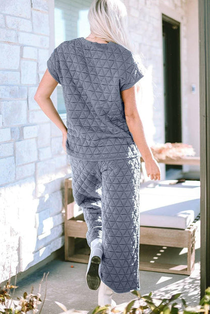 Ultimate Coziness Two-Piece Lounge Set with Trendy DetailsExperience Ultimate Coziness with our Two-Piece Lounge Set
 
 Stay cozy and chic in this trendy lounge set
 Short sleeve top and pocketed pants for a fashionable looLove Salve -Piece Lounge Setlounge