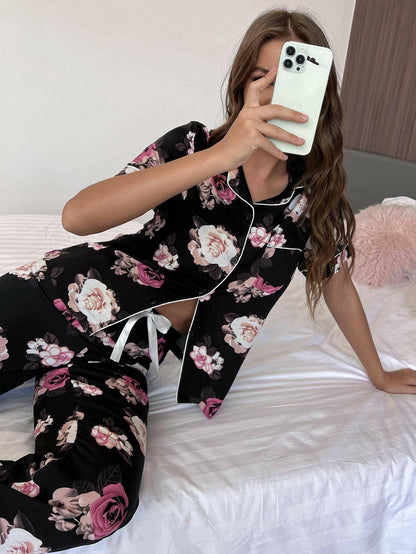 Floral Bliss Lounge Set with Short Sleeve Shirt and PantsUpgrade Your Loungewear with our Floral Bliss Lounge Set
 
 Chic Two-Piece Set: Embrace style and comfort with our floral design ensemble.
 Casual Yet Polished: PerfLove Salve Floral Bliss Lounge Setlounge