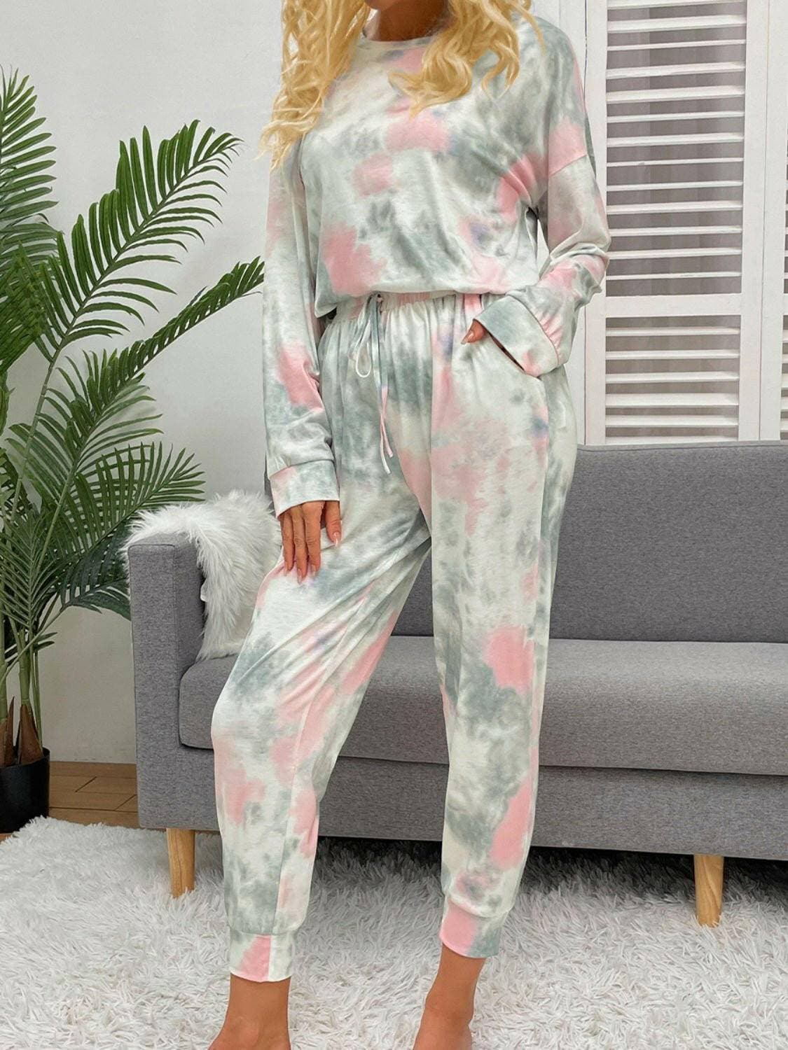 Trendy Tie-Dye Lounge Set with Round Neck Top and Drawstring PantsUpgrade Your Loungewear Collection with Our Trendy Tie-Dye Lounge Set
 Indulge in the perfect blend of comfort and style with our Tie-Dye Lounge Set, comprising a faLove Salve Trendy Tie-Dye Lounge Setlounge