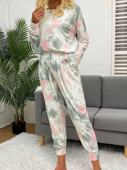 Trendy Tie-Dye Lounge Set with Round Neck Top and Drawstring PantsUpgrade Your Loungewear Collection with Our Trendy Tie-Dye Lounge Set
 Indulge in the perfect blend of comfort and style with our Tie-Dye Lounge Set, comprising a faLove Salve Trendy Tie-Dye Lounge Setlounge